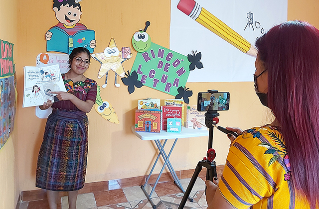 Child Aid literacy trainer records a sample lesson for teacher training workshops